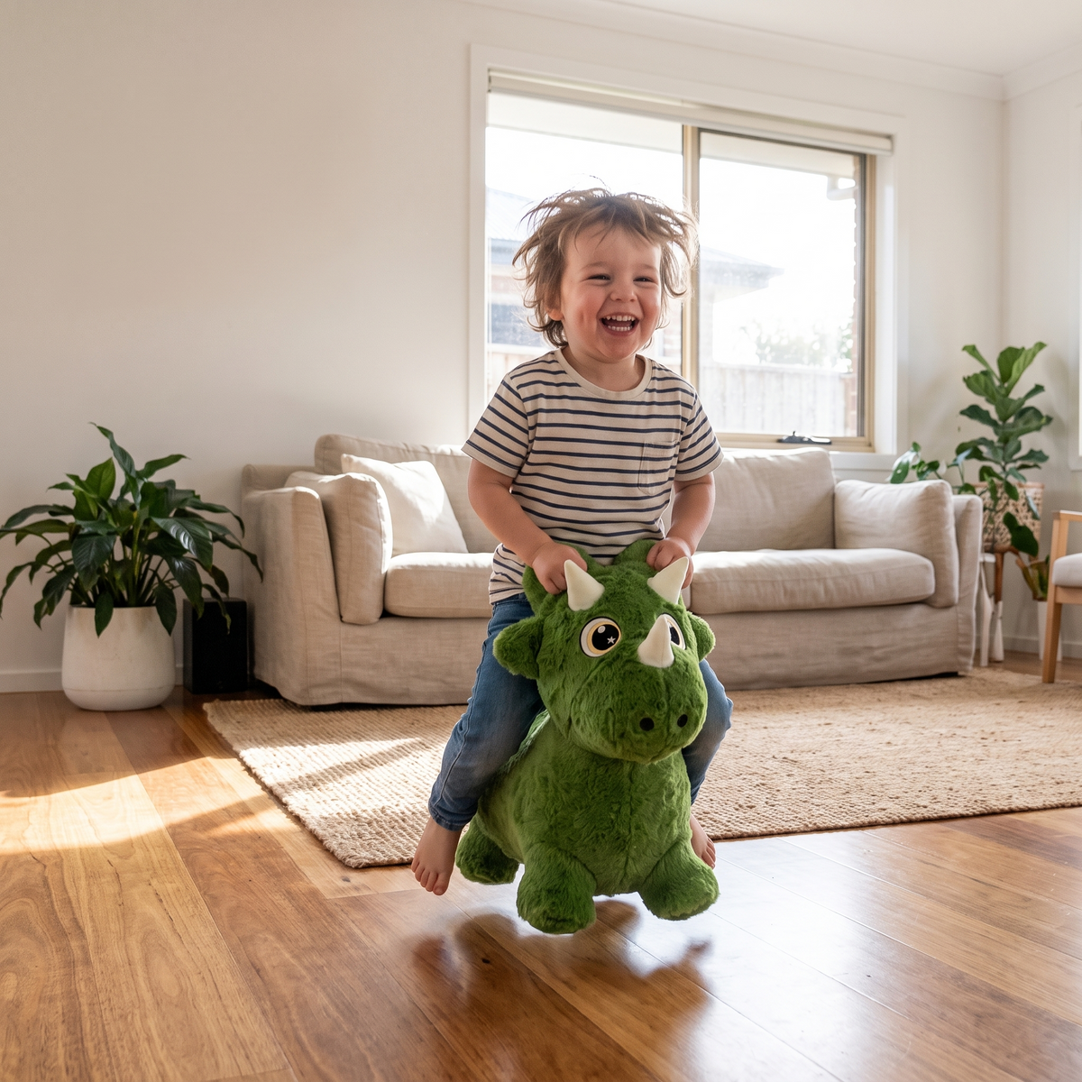 Child playing with Spike the Dinosaur bouncy toy in the lounge room
